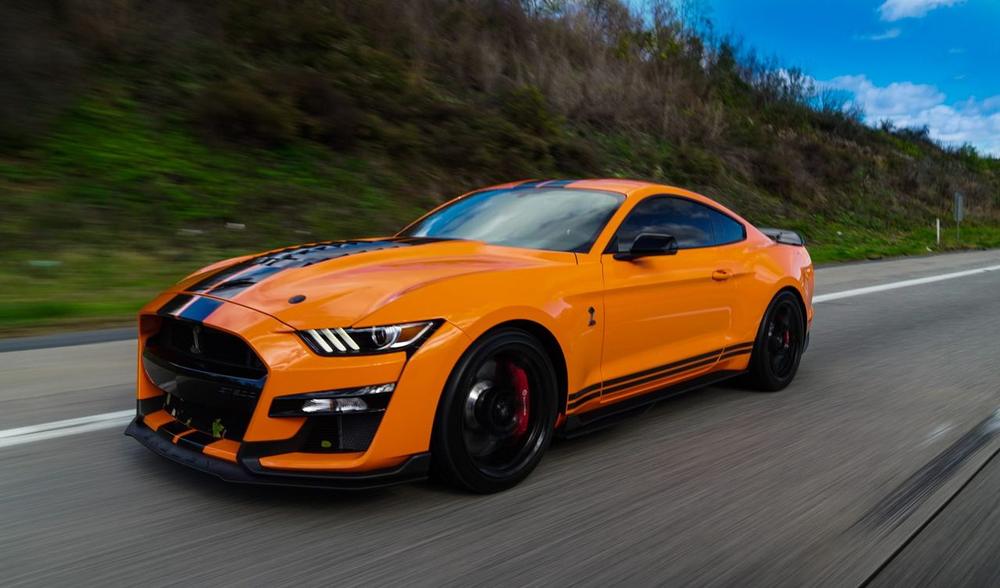 Orange Shelby GT500 showing deep, defect-free gloss after machine paint correction in Towson