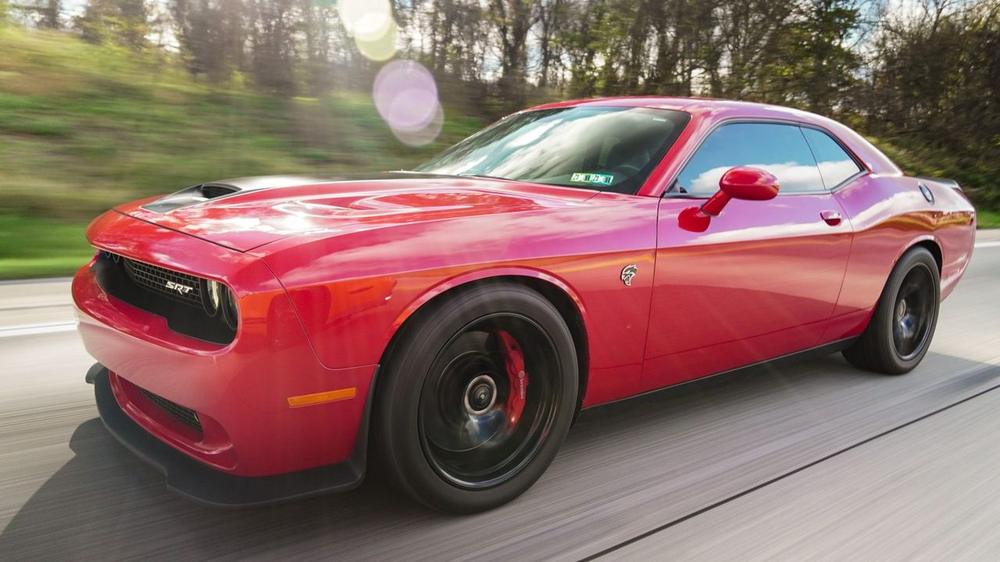 Red Dodge Challenger with a ceramic-coated gloss finish detailed in a Baltimore driveway